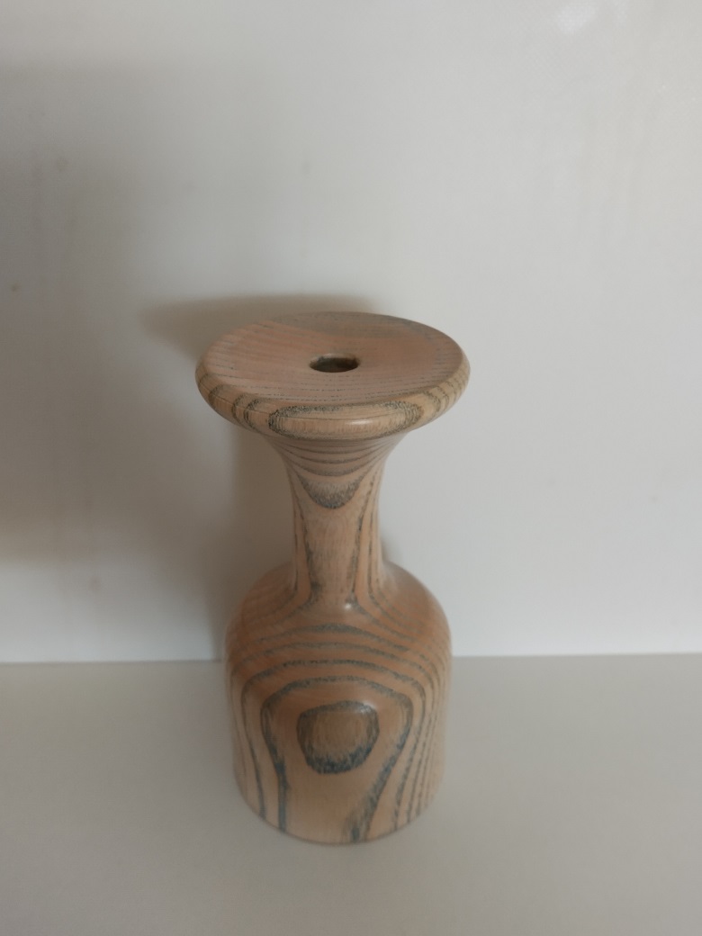 Picture of a spalted ash bud vase with blue polish.