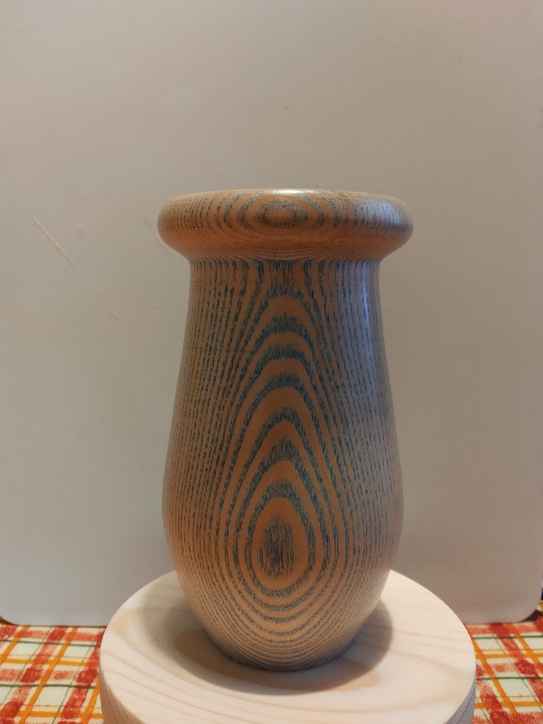 Picture of a spalted ash bud vase, with blue pigmentation.