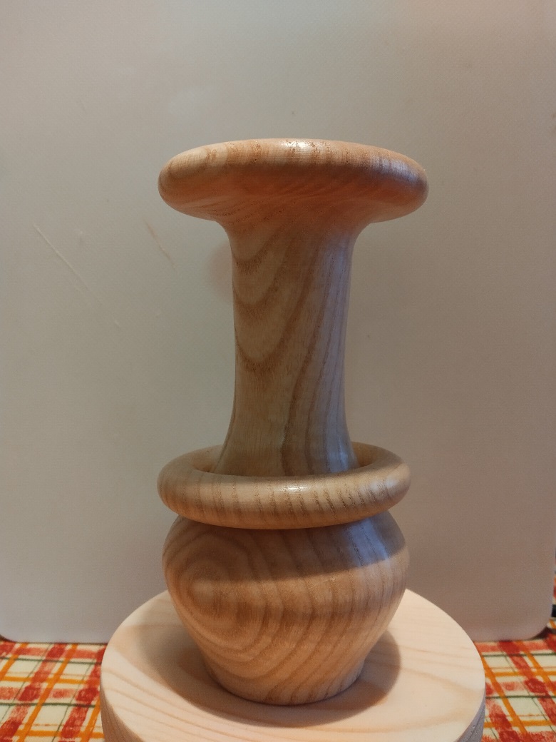 Picture of a spalted ash bud vase with captive ring.