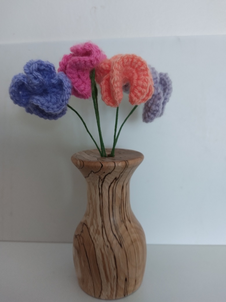 Picture of a spalted ash bud vase done as demo.